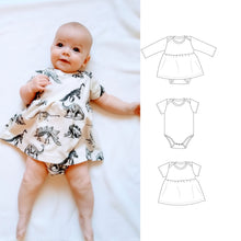 a baby wearing a onecie dress