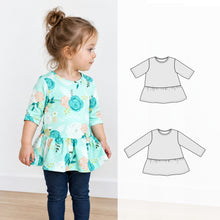 a girl wearing a flower print peplum top. 